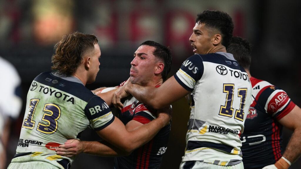 Cowboys forward Heilum Luki (right) is inspired by the resilience of teammate Reuben Cotter (left).
