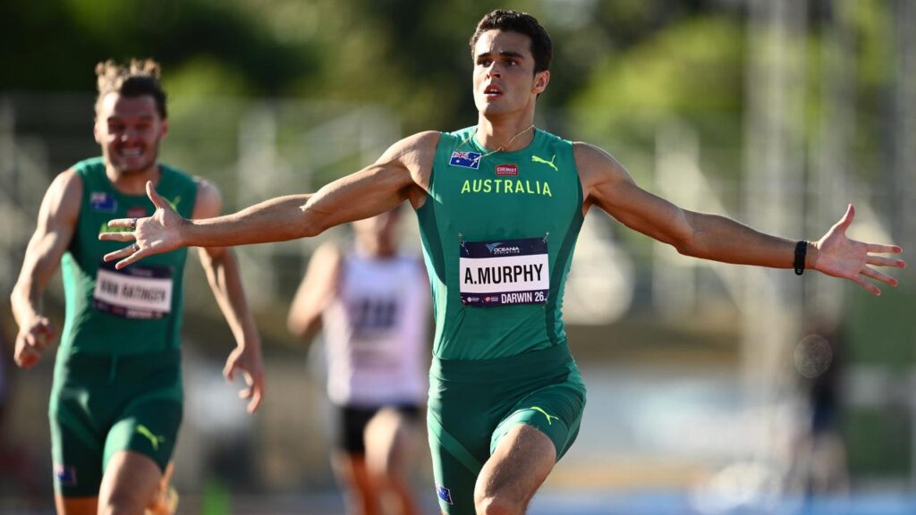 Aidan Murphy celebrates his 400m win at the Oceania championships. 
