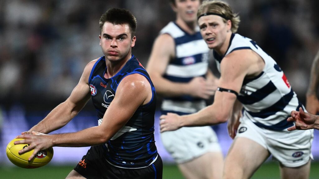 Kangaroos coach Alastair Clarkson has gone in to bat for one of his blooming defenders.
