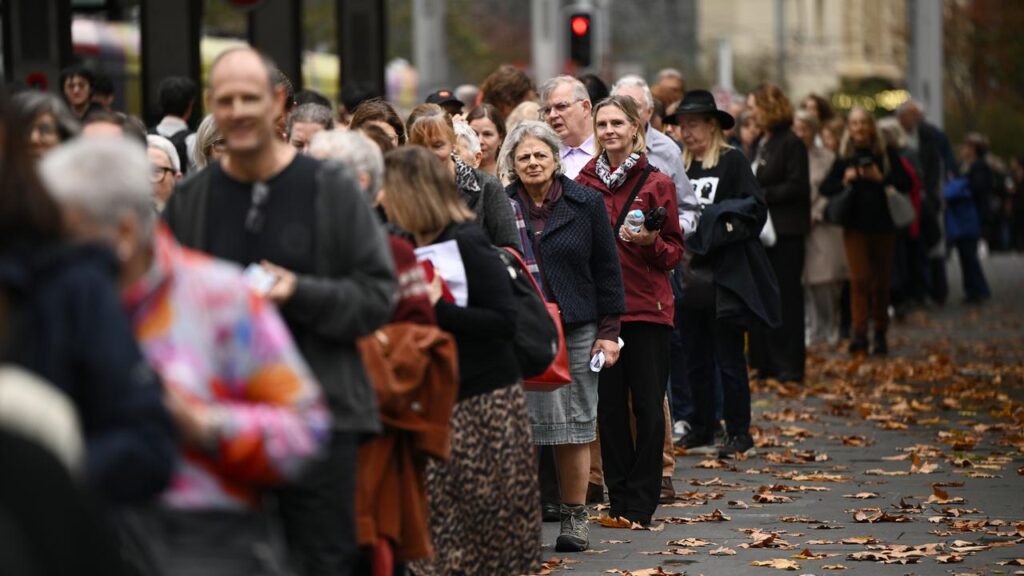 Mourners lined up to attend the memorial service for ABC presenter James Valentine.
