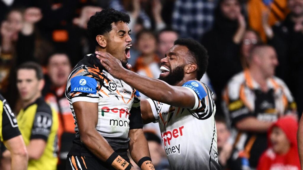 With big names back, Wests Tigers have held on to defeat the Bulldogs in a thrilling Sydney derby.
