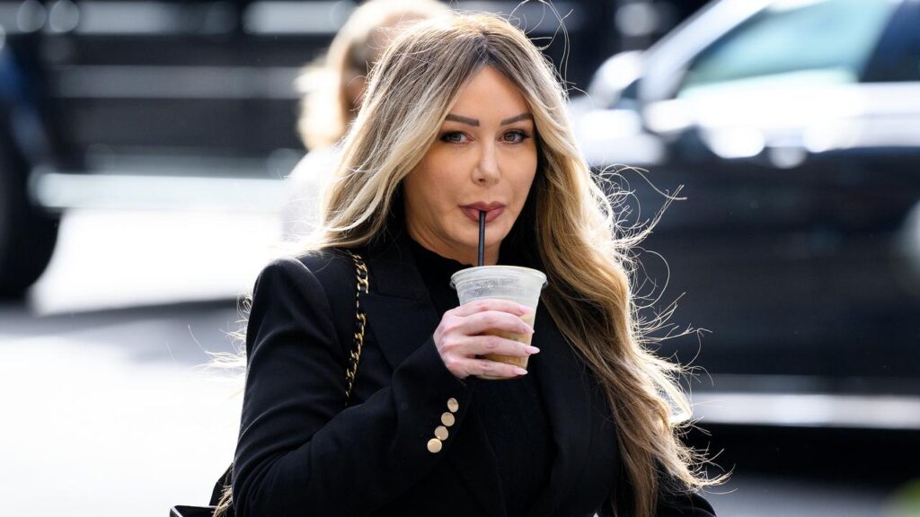 Fashion label founder Vicki Vlahos is standing trial accused of blackmailing her younger cousin.

