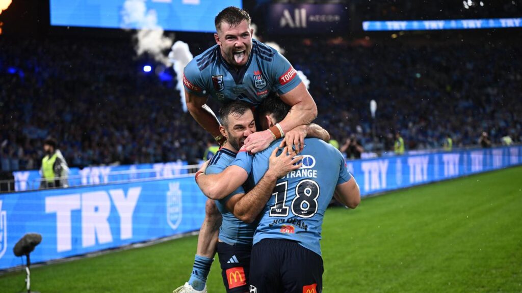 NSW have come from behind to beat Queensland with Ethan Strange (top) starring on debut.

