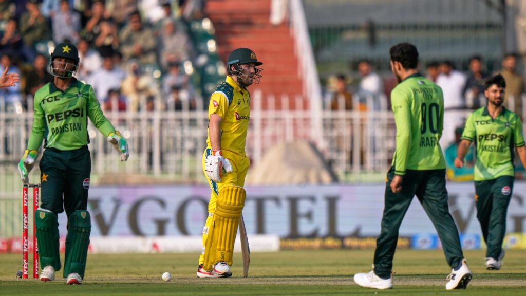 Josh Inglis (c) reacts after losing his wicket to Pakistan hero Arafat Minhas (c)
