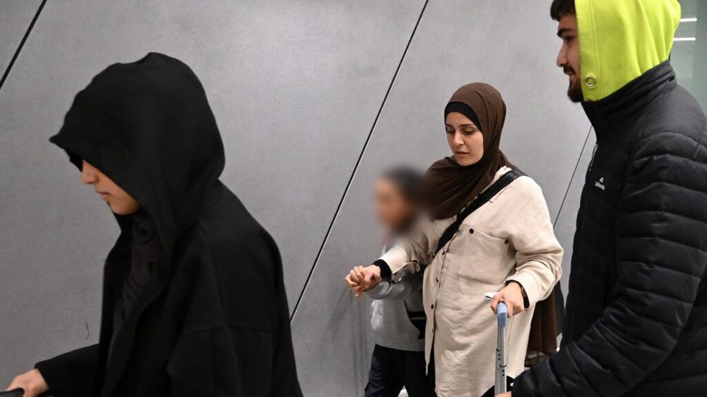 Women and children have arrived to tumultuous scenes on their return to Australia from Syria.
