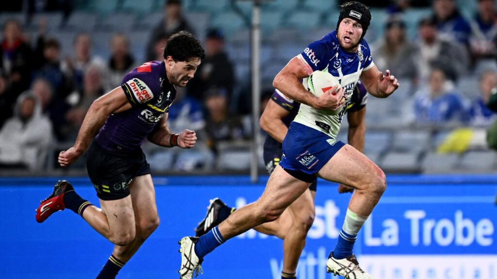 Matt Burton of the Bulldogs on the charge during their win over Melbourne Storm in Sydney.
