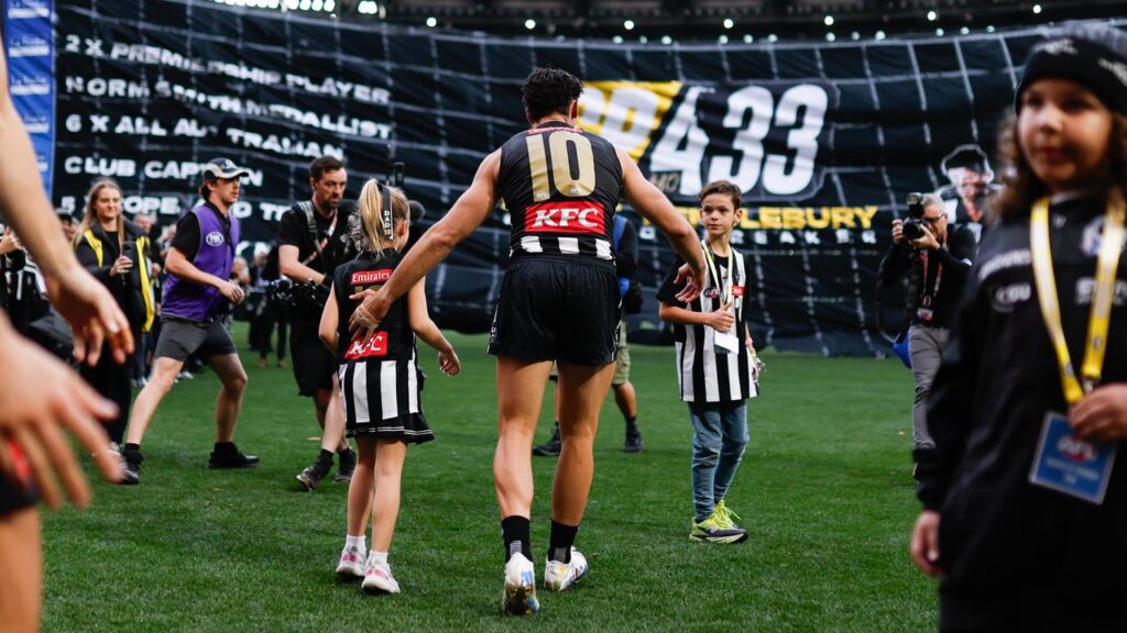 Scott Pendlebury walked out on to the MCG for his milestone match with his children Darcy and Jax.
