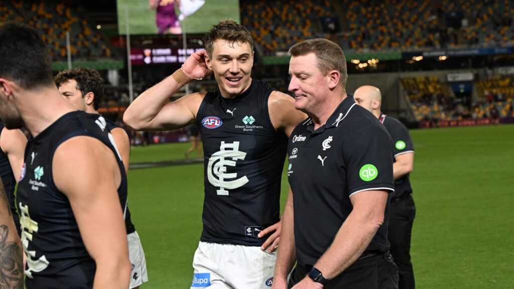 Patrick Cripps and coach Michael Voss ponder Carlton’s 11-point loss after a fightback.
