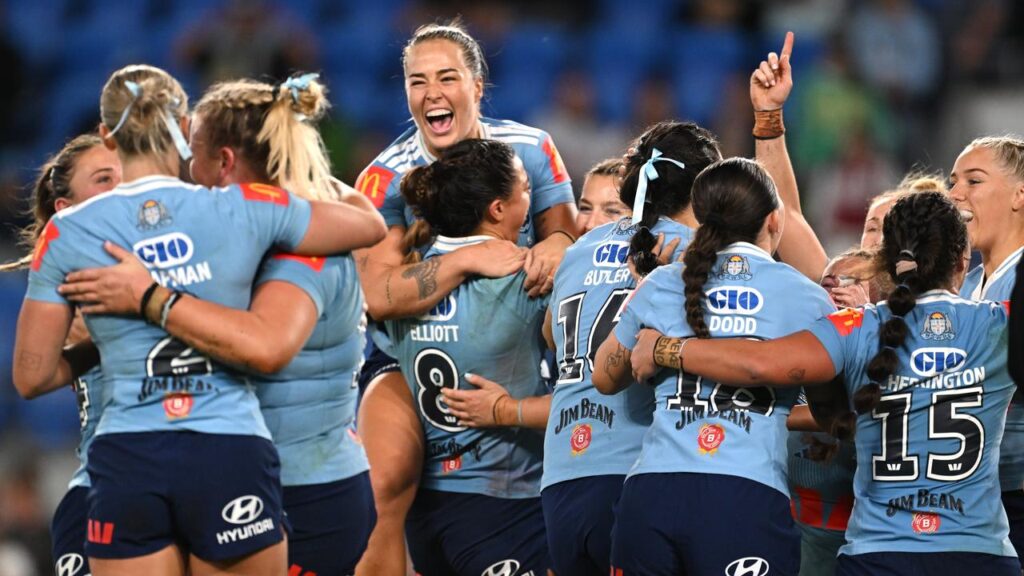 History: NSW players celebrate a first clean sweep in the women’s State of Origin series.
