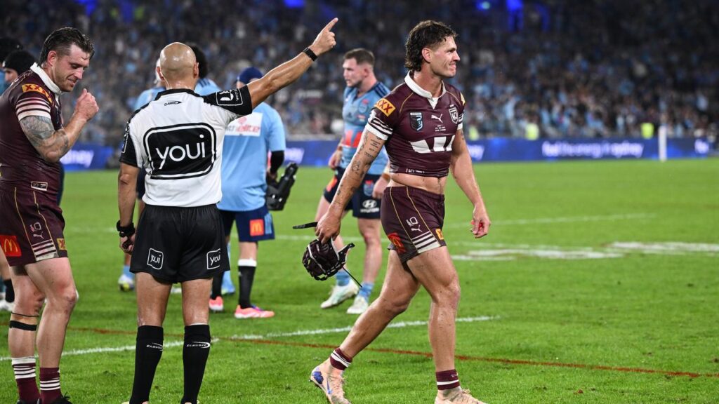 Maroon’s Kalyn Ponga is sent off by referee Ashley Klein while Cameron Munster argues the call.
