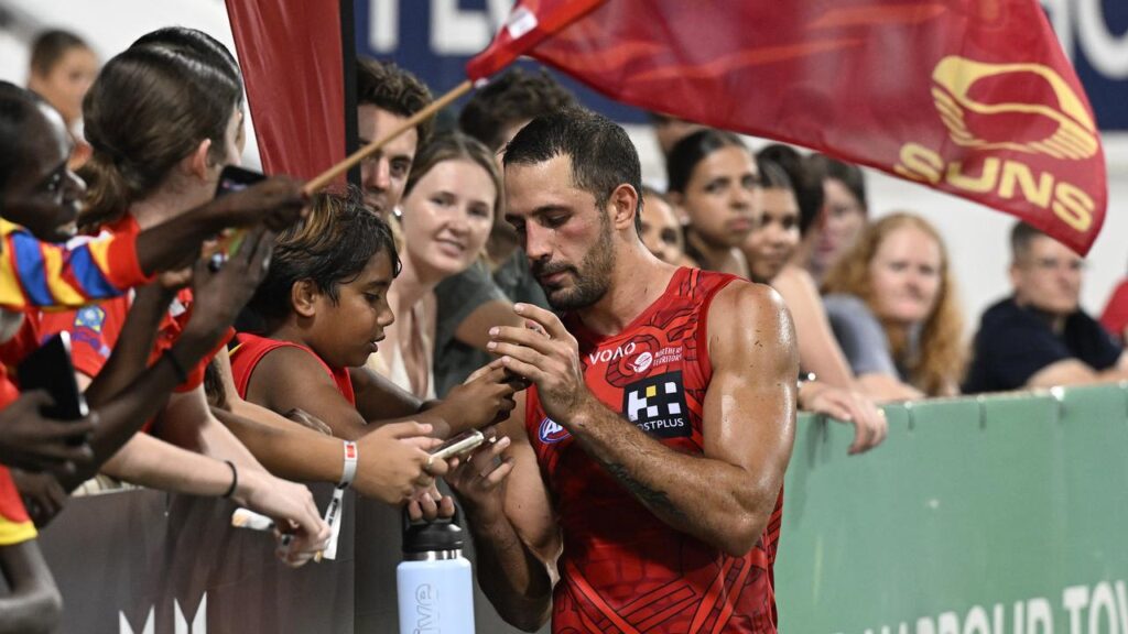 Gold Coast’s Ben Long meets the locals after their AFL win over St Kilda in Darwin.
