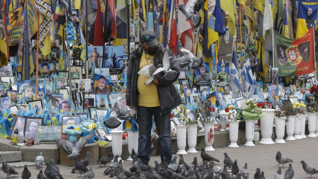 Amid the chaos of drone attacks across the country, a Ukrainian man in Kyiv stops to feed pigeons.
