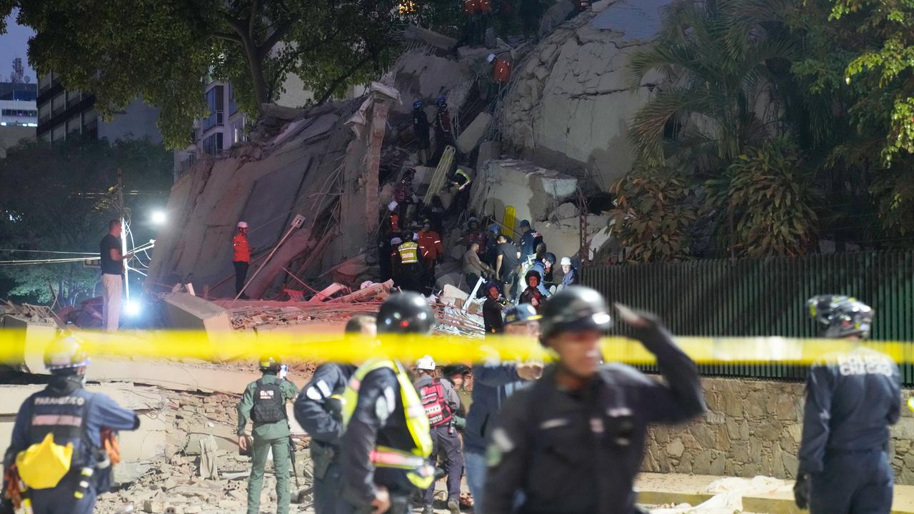 Rescue workers search for survivors in Caracas