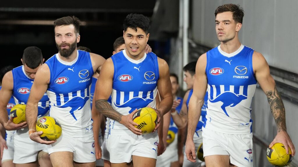 The AFL was unimpressed when Jy Simpkin (right) defended Paul Curtis (centre) on social media.
