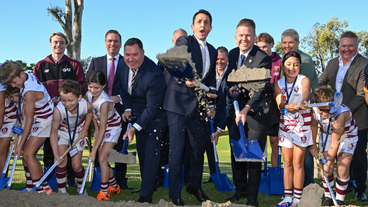 Premier David Crisafulli shovels sand (file image)