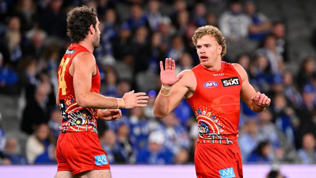 Gold Coast are fighting to keep sought-after forwards Ben King (l) and Jed Walter (r) at the club.
