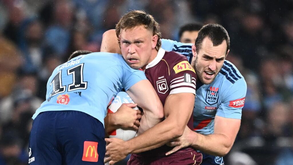 Queensland’s Reuben Cotter (centre) is ready for his battle with NSW counterpart Isaah Yeo (right).
