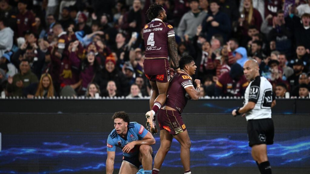 Queensland winger Selwyn Cobbo (right) celebrates one of his three tries with Hamiso Tabuai-Fidow.
