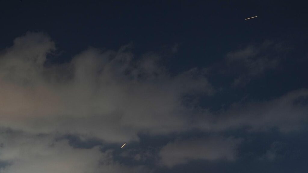 Iran says it launched missiles at Israel in response to Israeli attacks on Lebanon’s capital Beirut.
