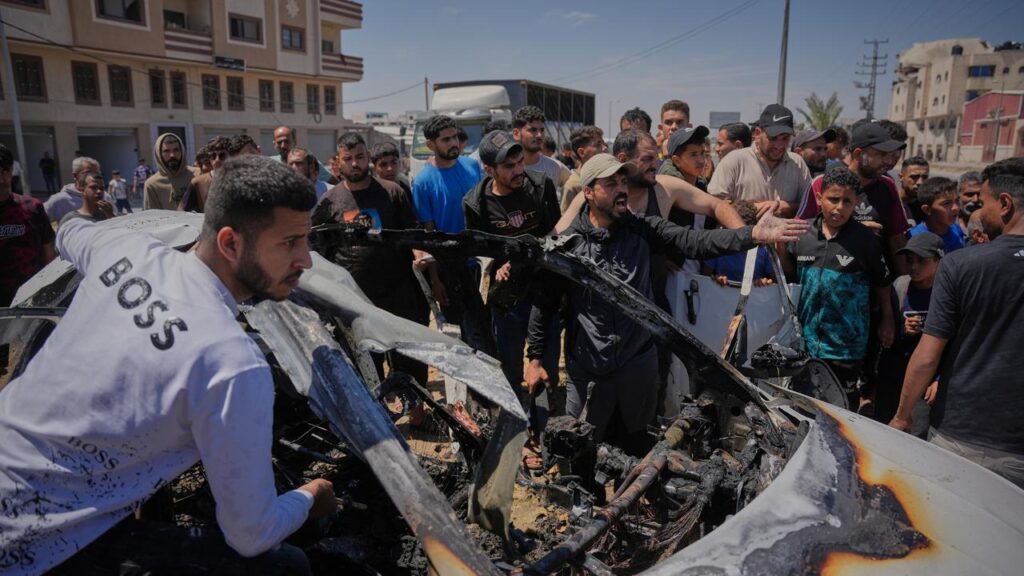 A car hit by an Israeli air strike in Gaza resembled a mangled skeleton.
