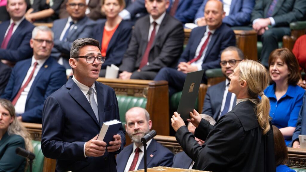 Andy Burnham has been sworn in as a Labour parliamentarian after winning a by-election.

