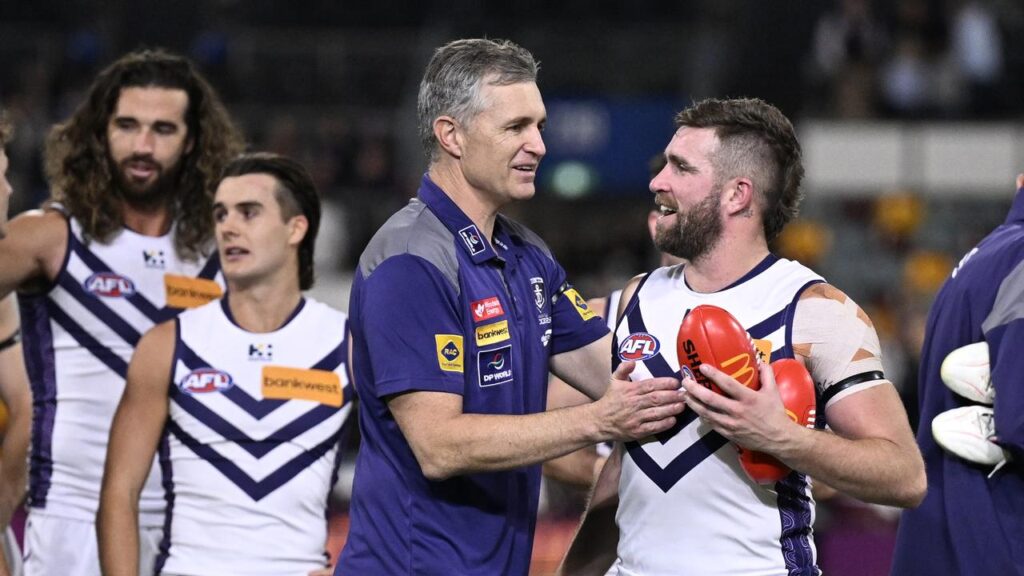 Justin Longmuir says his ladder-leading Dockers are handling the building hype around them superbly.
