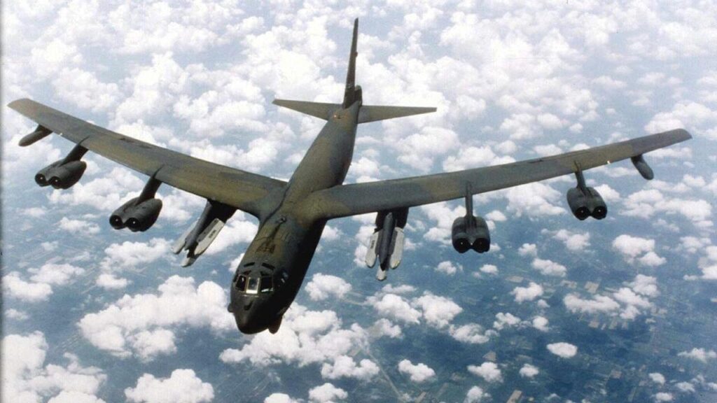 The B-52 Stratofortress, typically crewed by five people, entered service in 1955.

