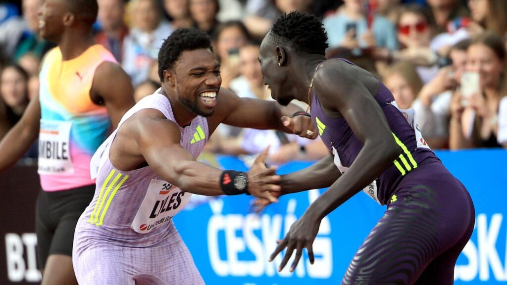 Noah Lyles and Gout Gout celebrate after their 150m showdown in Ostrava. 
