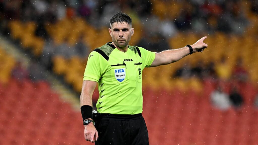 Australian World Cup official Shaun Evans has landed in hot water over a hand gesture.
