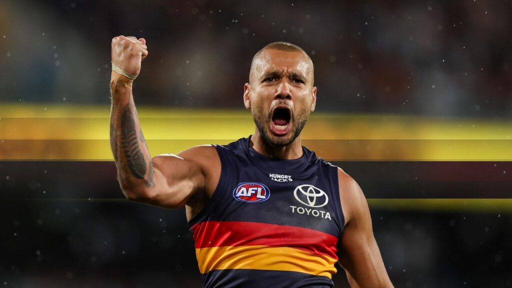 Crows’ Callum Ah Chee celebrates a goal against Cats before picking up a hamstring injury.
