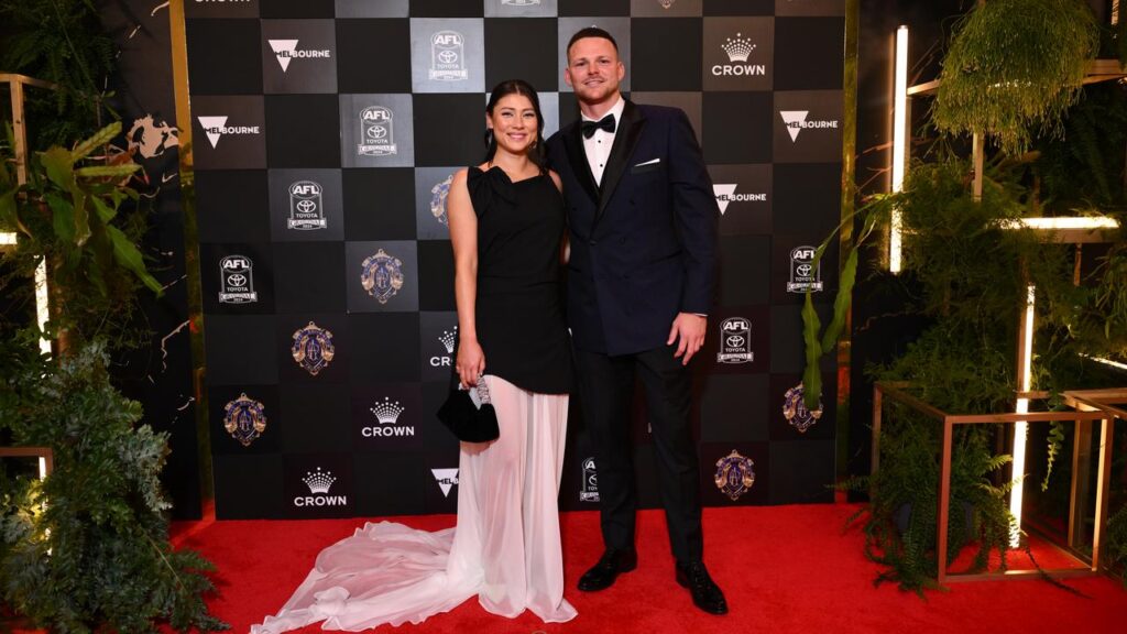 Melbourne have apologised to Sachi Dade (l), partner of Steven May (r), over privacy breaches.

