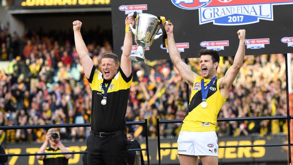 Damien Hardwick and captain Trent Cotchin celebrate Richmond’s drought-breaking 2017 premiership.
