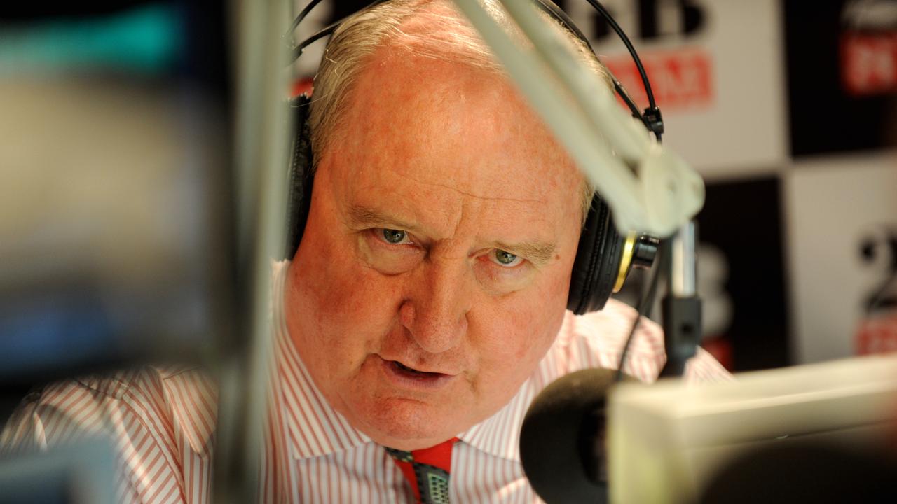 alan jones behind microphone