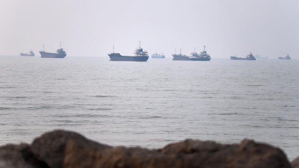 A vessel travelling in the Strait of Hormuz has been hit by a projectile, the British military says.

