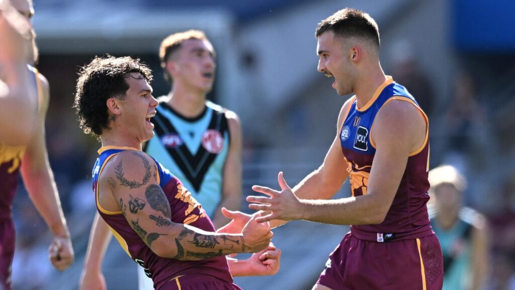 Brisbane have crushed Port Adelaide at the Gabba, with Cam Rayner (l) among the goals.
