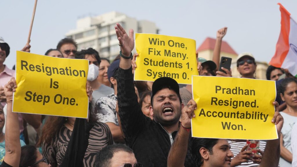 Protesters have cheered news that Indian Education Minister Dharmendra Pradhan has resigned.
