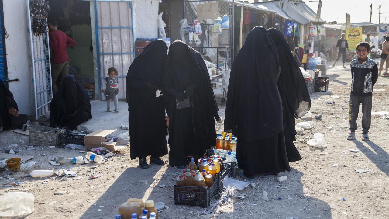 four women in full Islamic dress