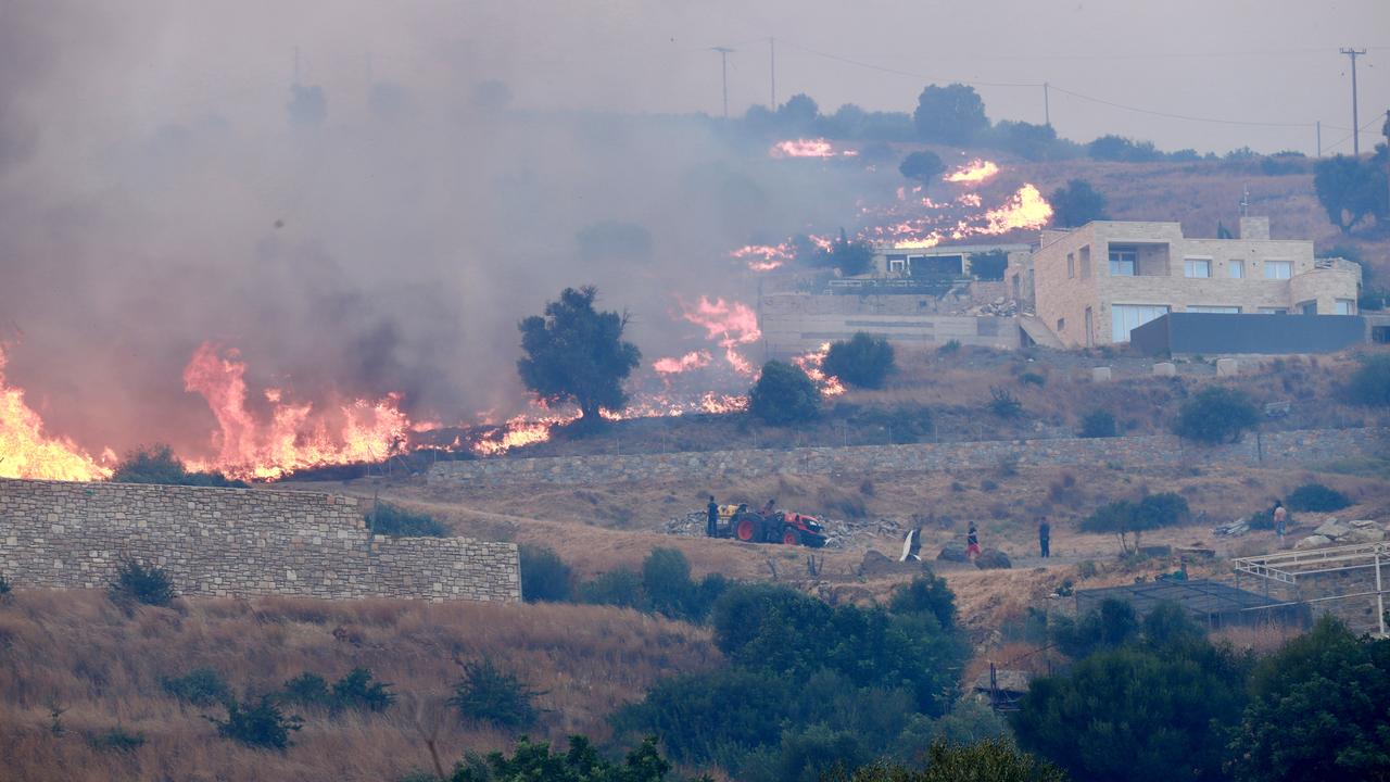 A fire burns through vegetation in Krya Vrysi, Rethymno, Crete
