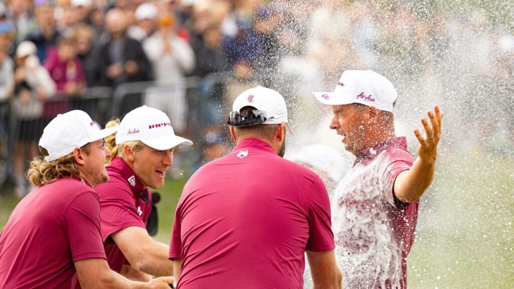 Lucas Herbert, right, is sprayed with champagne by Cameron Smith, Marc Leishman and Travis Smyth 
