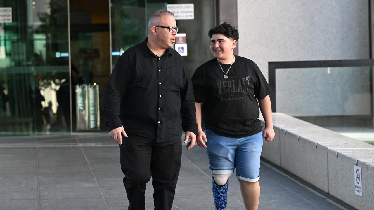 father and son walk out of courthouse