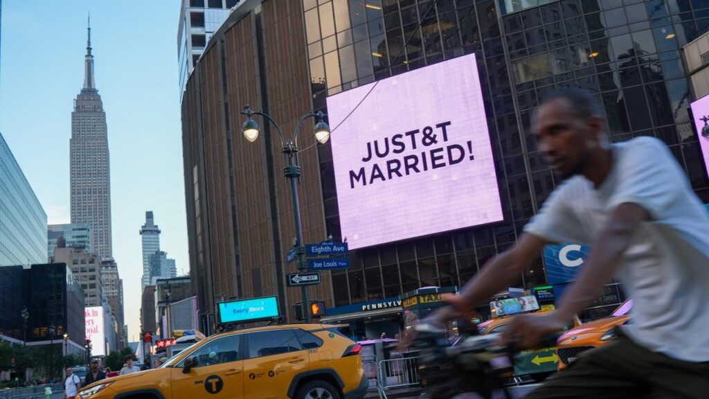 A sign at Madison Square Garden announces that Taylor Swift and Travis Kelce have tied the knot.
