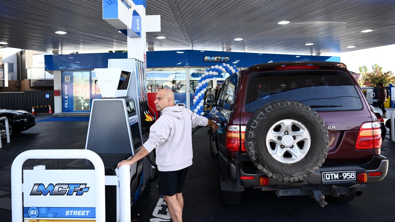Motorists fill-up at a petrol station in Melbourne