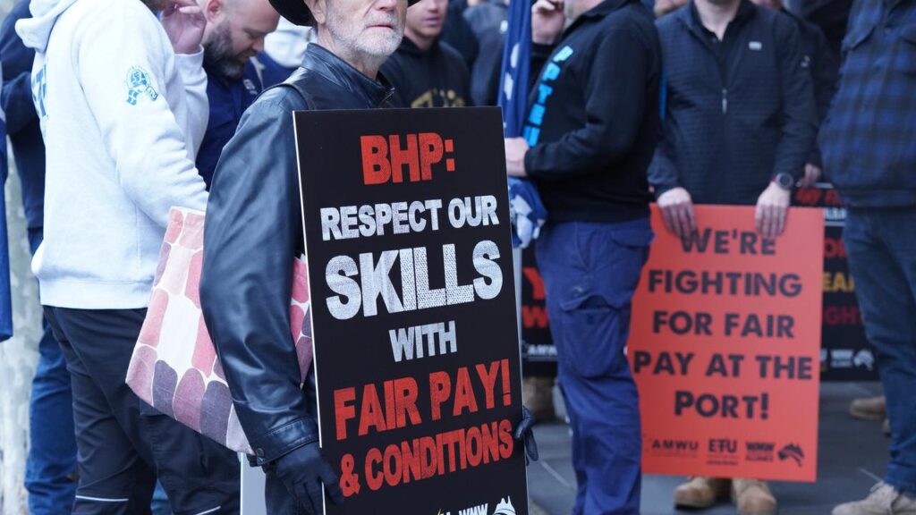 Unionists have rallied outside BHP offices in Melbourne in solidarity with their WA counterparts.
