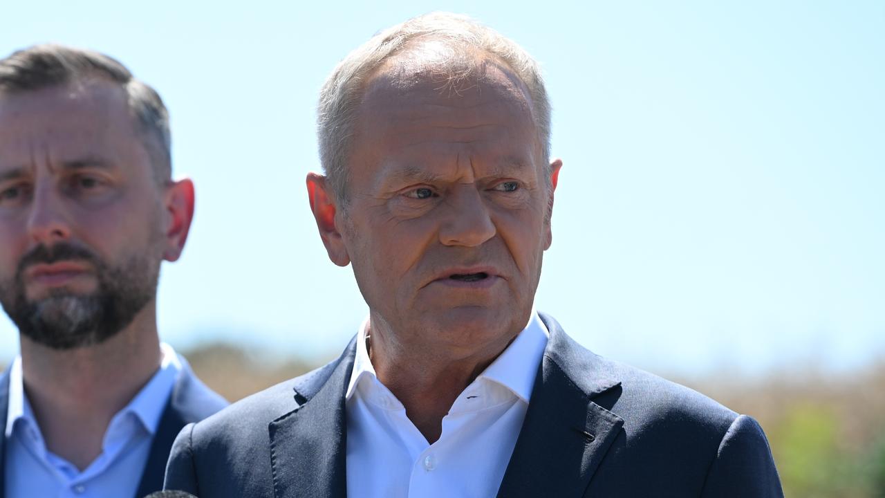 Polish Prime Minister Donald Tusk speaks to reporters