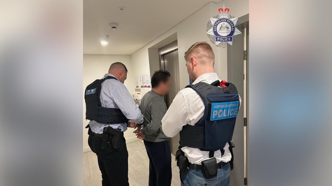 man being handcuffed by police officer