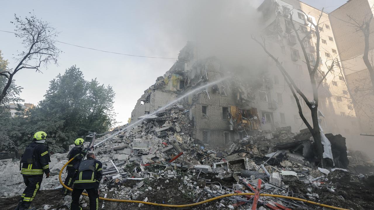Ukrainian rescuers at the site of a Russian missile strike in Kyiv