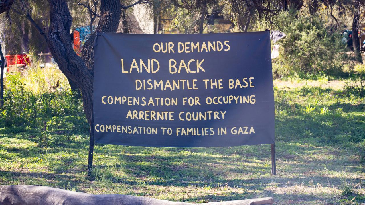 A protest sign at the Close Pine Gap symposium