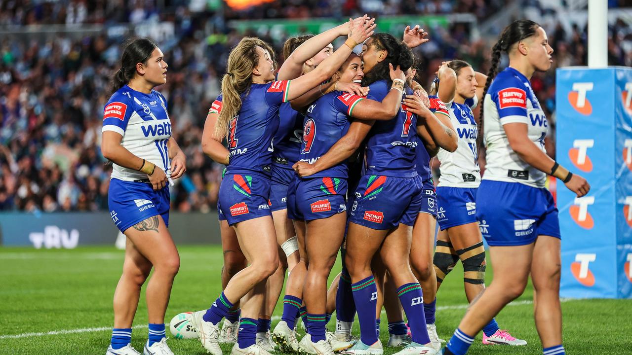 Warriors celebrate a try