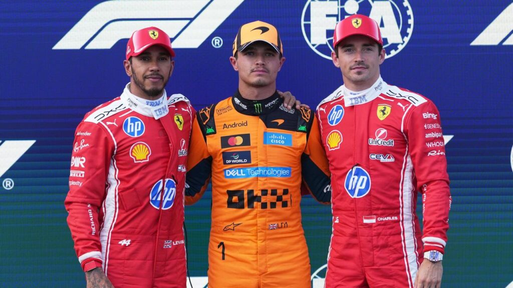 Lewis Hamilton (left), with Lando Norris and Charles Leclerc, before his demotion.
