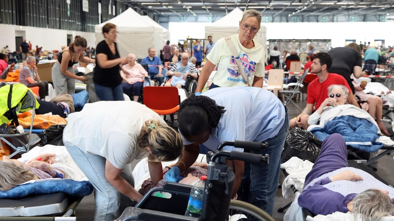 Wildfire evacuees rest in the Bordeaux Exhibition Centre, France